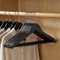 Black wooden suit hangers for retail display