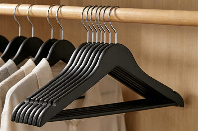 Black wooden suit hangers for retail display