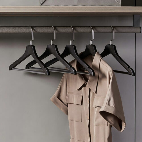 Bulk black wooden hangers packed in export cartons
