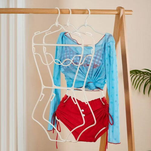 Plastic swimwear hanger with clips for bikinis